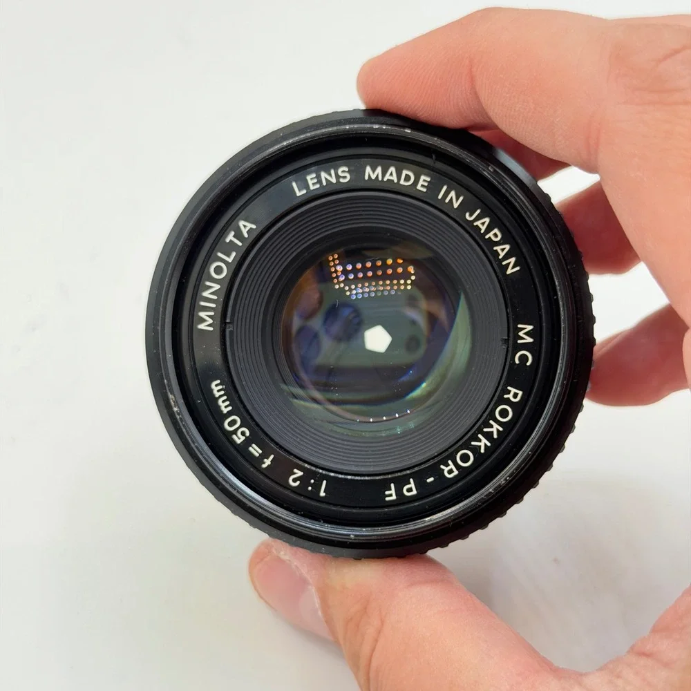 Minolta MC Rokkor-PF 50mm f/2 Lens with 55mm Skylight 1A Hood SR Mount 1126884